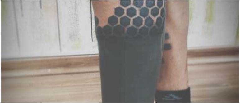 Black out leg tattoo